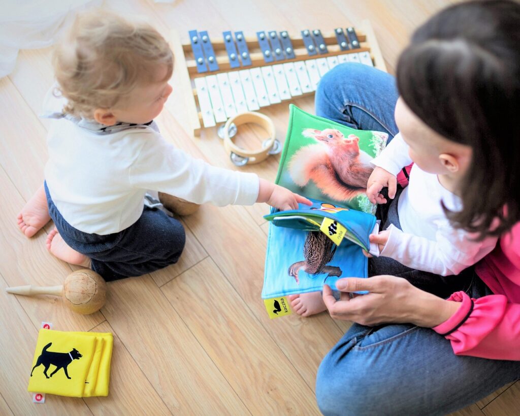 family, children, baby, child, happy, people, kids, together, happiness, mother, woman, love, infant, parent, childhood, play, toys, floor, son, boy, book, reading, sitting, toddler, mom